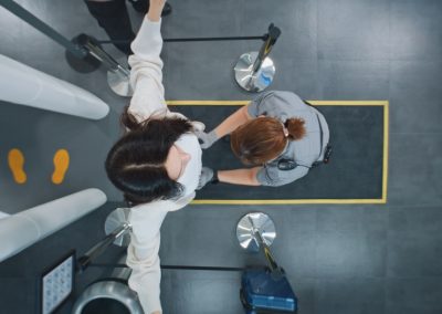 Security,Checkpoint,In,Airport,Terminal:,Diverse,People,Walking,Through,X-ray