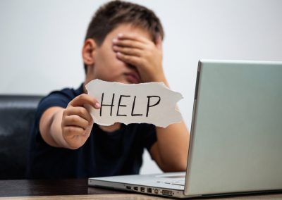 Sad,And,Scared,Young,Boy,With,Computer,Laptop,Suffering,Cyberbullying