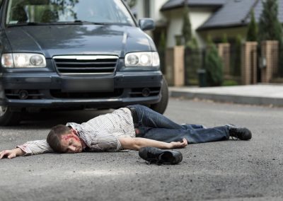 Pedestrian,Hit,By,A,Car,Lying,On,The,Street