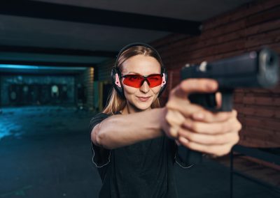 Young,Woman,Concentrated,On,Shooting,At,A,Target