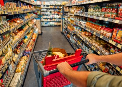 Publix just made one massive announcement about guns that left Walmart in a frenzy A,Man,With,A,Cart,Walks,Between,Store,Shelves,And