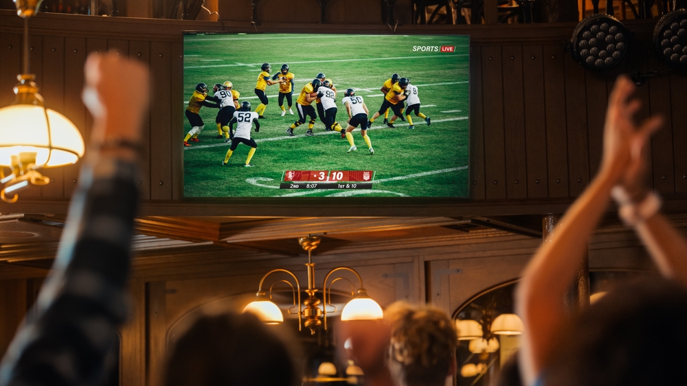 Group,Of,American,Football,Fans,Watching,A,Live,Match,Broadcast
