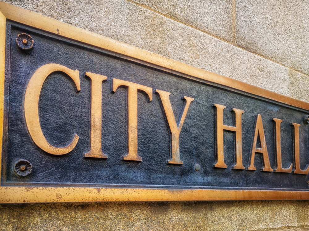 Exterior,Sign,That,Reads,”city,Hall”,In,Brass,Lettering.,Close