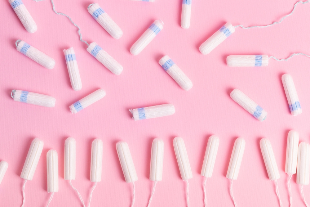 Many,Cotton,Menstrual,Tampons,From,Above,On,A,Pink,Background.