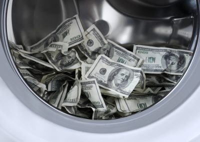 Many,A,Hundred,Dollar,Bills,Inside,The,Drum,Of,A