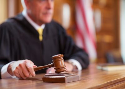 Judge,Banging,Gavel,In,Court