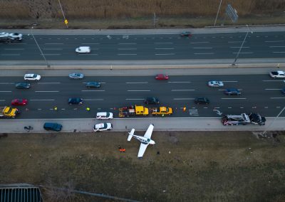 Emergency,Airplane,Landing,On,Highway.,Above,Wide,Drone,Shot