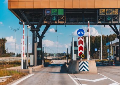 Toll,Station.,Crossing,Toll,Road,Gates,At,Sunny,Summer,Day