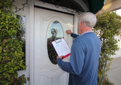 Man,Canvassing,A,Neighborhood,Taking,A,Survey