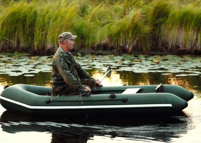 An,Elderly,Man,Is,Sailing,On,A,Rubber,Boat,With