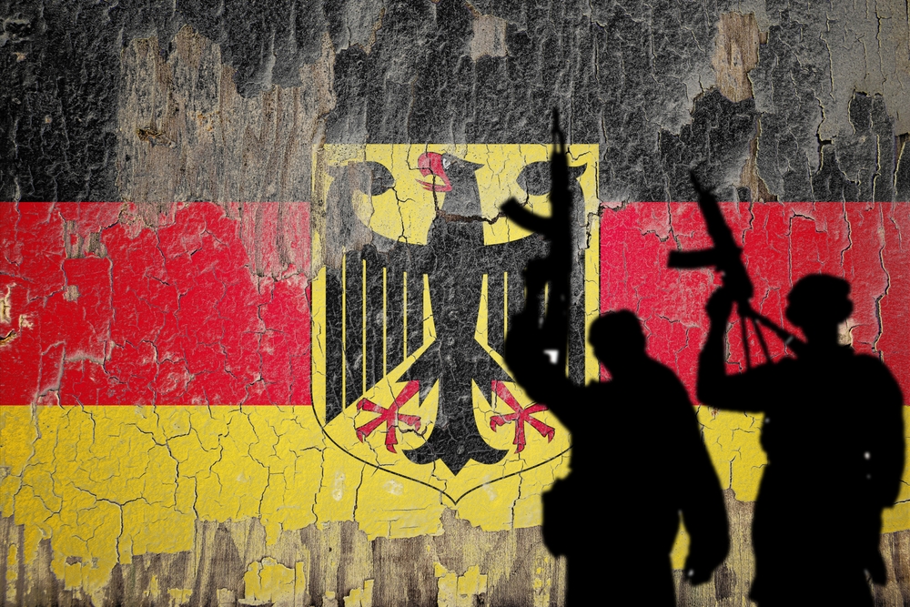 Flag,Of,Germany,Painted,On,The,Cracked,Wall,With,Terrorist