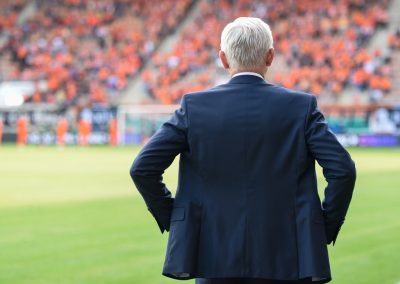 Head,Coach’s,Back,And,Soccer,Match,At,The,Stadium,In