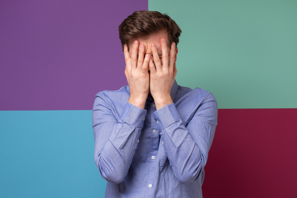 Caucasian,Man,Covering,His,Face,Feeling,Humiliated.,Studio,Shot