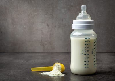 Bottle,Of,Baby,Milk,On,Dark,Grey,Table
