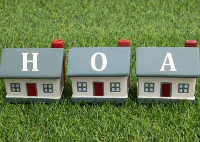 Hoa,Home,Owners,Association,With,Three,Houses,On,Artificial,Green