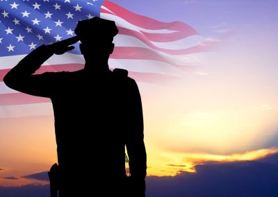 Silhouette,Of,Police,Man,With,Usa,Flag,Against,The,Sunset.