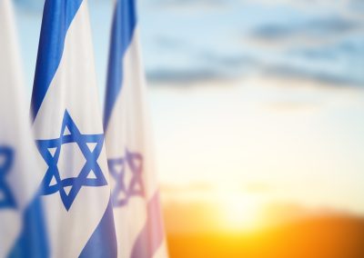Israel,Flags,With,A,Star,Of,David,Over,Cloudy,Sky
