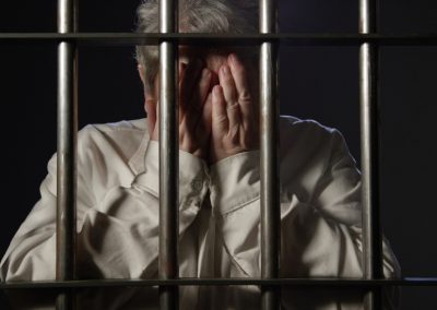 Elderly,Woman,In,Dark,Prison,Behind,Bars,Of,The,Jail