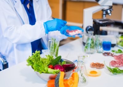 Middle-aged,Female,Laboratory,Worker,Wearing,Blue,Gloves,Conducts,Lab,Test