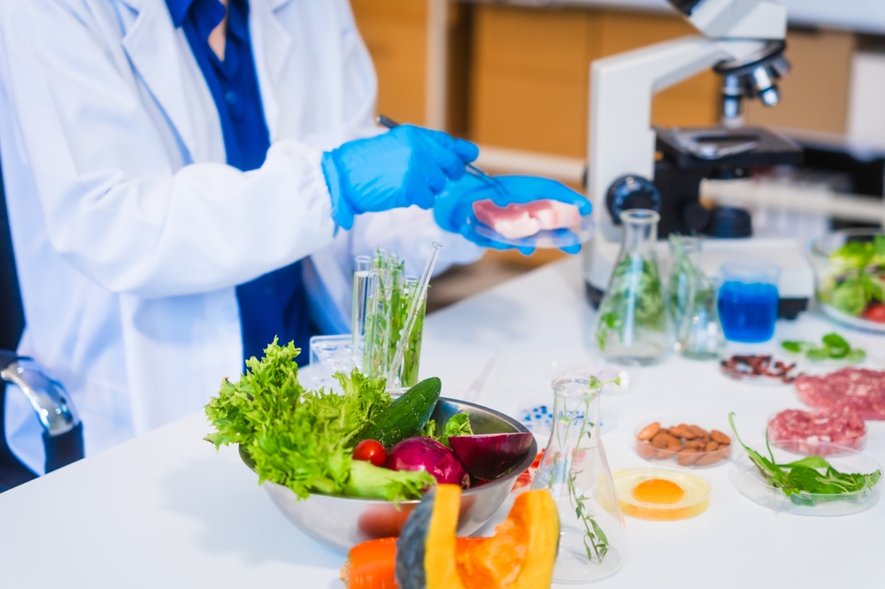 Middle-aged,Female,Laboratory,Worker,Wearing,Blue,Gloves,Conducts,Lab,Test