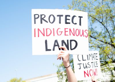 Caucasian,Hand,Holding,Sign,Reading,”protect,Indigenous,Land”,At,A