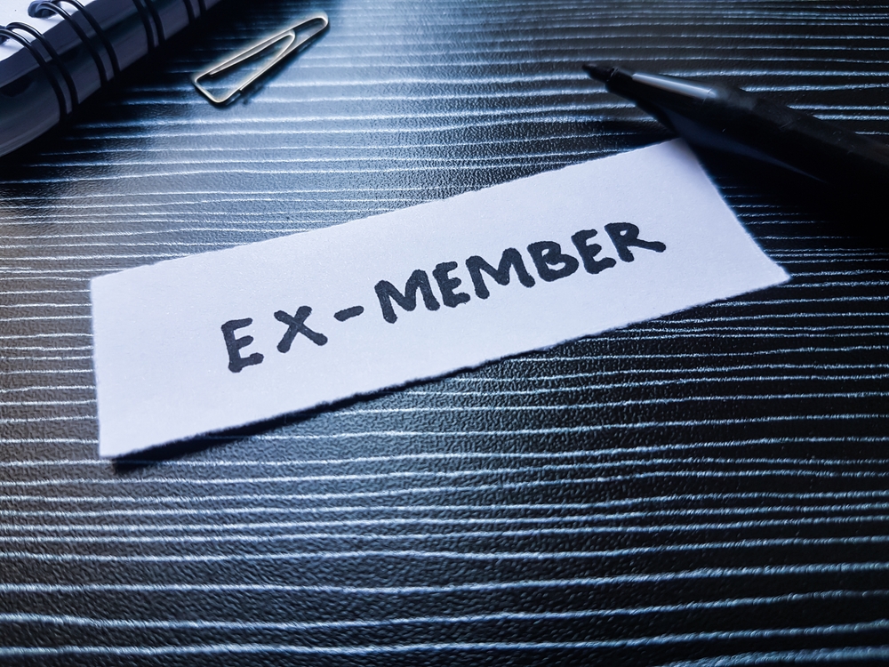 Ex,-,Member,Writting,On,Table,Background.
