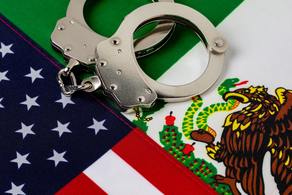 United,States,And,Mexico,Flags,With,Handcuffs.,Border,Security,,Immigration