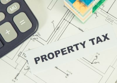 Inscription,Property,Tax,With,Small,House,Made,Of,Colorful,Toy