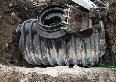 Installation,Of,A,Single-chamber,Home,Sewage,Treatment,Plant,,The,Excavator