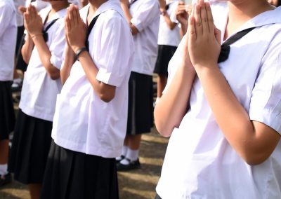 A,Group,Of,Children,Are,Praying,In,A,Line.,They