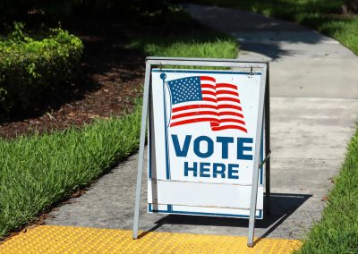 Vote,Here,Sign,Placed,On,The,Walkway,To,A,Neighborhood