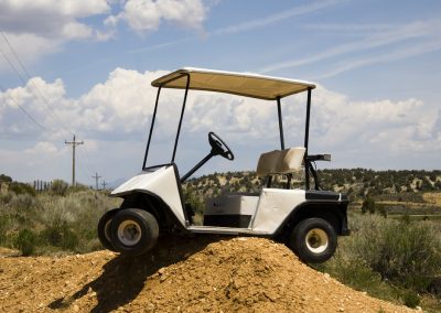 Golf,Cart,High,Centered,On,A,Dirt,Mound