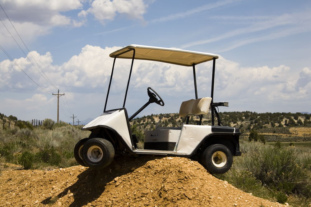 Golf,Cart,High,Centered,On,A,Dirt,Mound