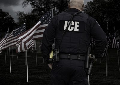 Florida Leads the Nation in ICE Arrests and Ron DeSantis Just Told Every Other Governor Why They Are Failing An,Immigration,(ice),Officer,Stands,In,Front,Of,Rows,Of