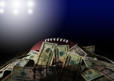 A,Football,Covered,In,A,Pile,Of,Cash,Under,Stadium