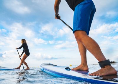 Man,,Woman,,Having,Fun,Practice,Paddle,Surf,In,Spain