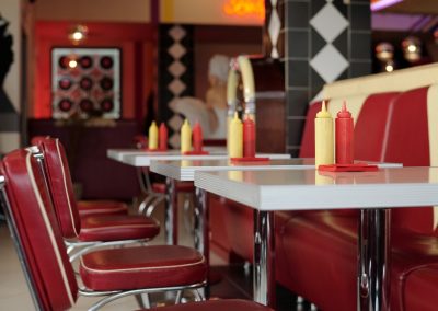 Retro-style,Diner,With,Classic,Red,And,Yellow,Dining,Booth,,Condiment