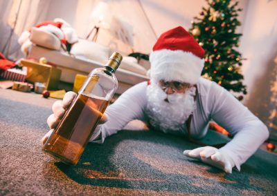 Selective,Focus,Of,Drunk,Bad,Santa,Holding,Bottle,Of,Whiskey
