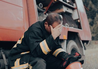 Depressed,And,Tired,Firefighter,Near,Fire,Truck.