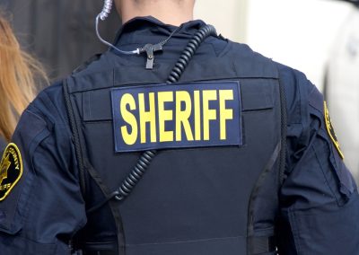 Close,Up,On,Sheriff,Title,Logo,On,Back,Of,Flack