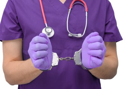 Doctor,Arrested,,Hands,In,Police,Handcuffs,Close,Up