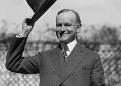 President,Calvin,Coolidge,Waves,A,Hat,Presented,To,Him,By