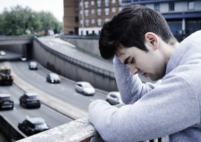 A Florida Officer Talked a Man Off a Parking Garage Ledge and His Body Camera Caught Every Word Depressed,Young,Man,Contemplating,Suicide,On,Road,Bridge