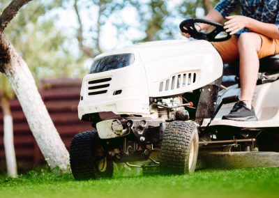 Close,Up,Details,Of,Landscaping,And,Gardening.,Worker,Riding,Industrial