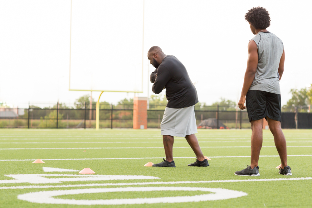 American,Football,Coach,Training,An,Athlete.