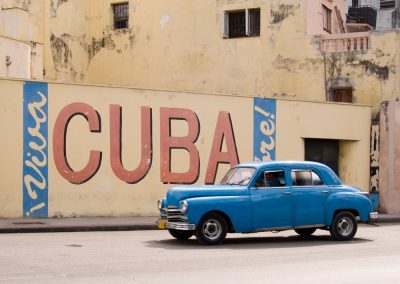 Ron DeSantis Just Warned That Cuba and Venezuela Could Slip Away and He Is Right A,Vintage,1950’s,American,Car,Passing,A,’viva,Cuba’,Sign