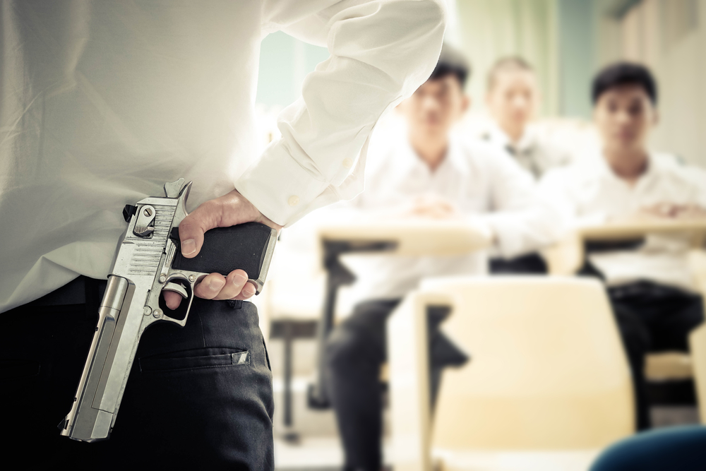 A,Lecturer,Holding,A,Gun,In,His,Hand,In,A