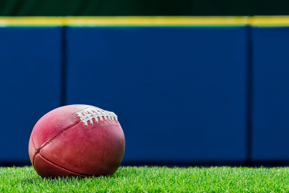 A,Low,Angle,View,Of,A,Pro,American,Football,Sitting