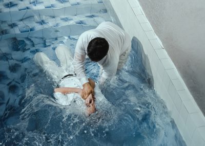 A,Protestant,Pastor,Baptizes,A,Man,In,Water,In,The