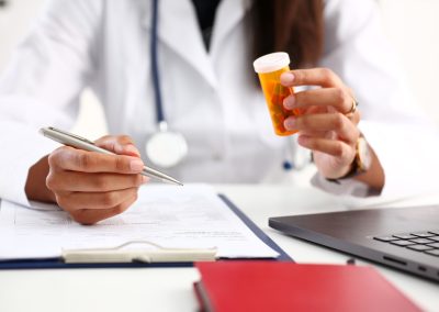 A Florida Judge Handed Tiger Woods Drug Records Over After His Attorney Tried to Block Them Female,Black,Medicine,Doctor,Hand,Hold,Jar,Of,Pills,And
